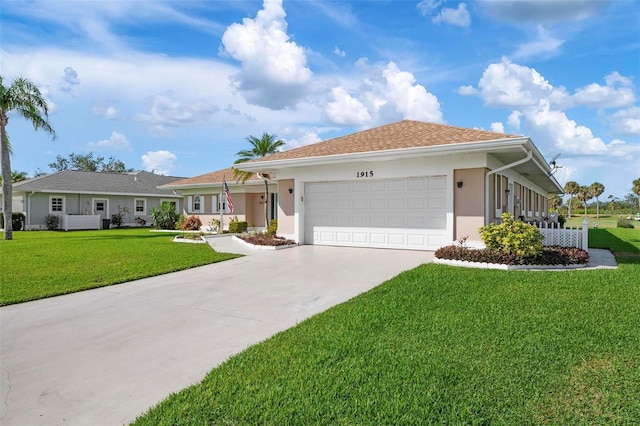 1915 Pebble Beach Ct, Venice, FL 34293 - ranch-style house featuring an attached garage, a front yard, concrete driveway, and stucco siding