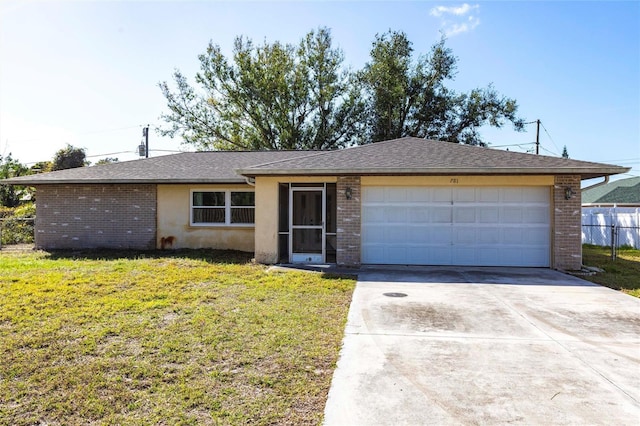 ranch-style home featuring a garage, driveway, fence, a front yard, and brick siding