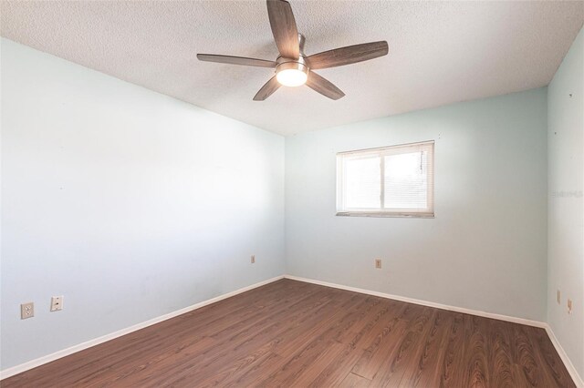 unfurnished room featuring ceiling fan, a textured ceiling, baseboards, and wood finished floors