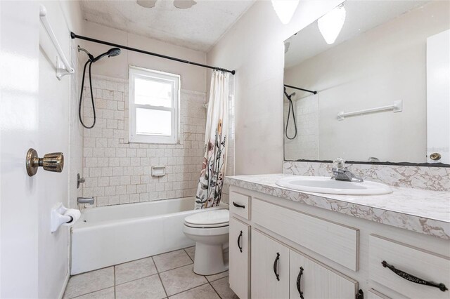 full bathroom featuring toilet, vanity, shower / bath combination with curtain, and tile patterned floors