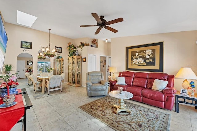 3300 Loveland Blvd Unit 1201, Punta Gorda, FL 33980 - living room with light tile patterned floors, arched walkways, and ceiling fan with notable chandelier