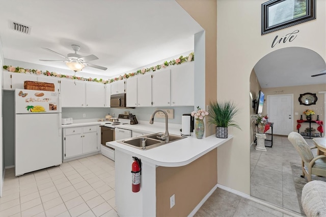 3300 Loveland Blvd Unit 1201, Punta Gorda, FL 33980 - kitchen featuring white cabinets, white appliances, light countertops, and a sink