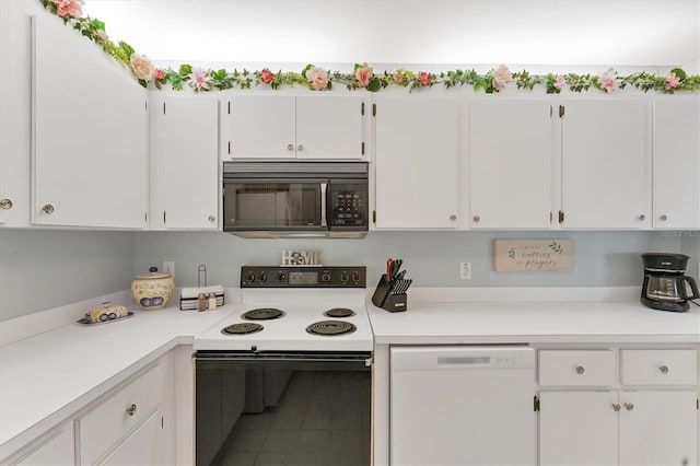 3300 Loveland Blvd Unit 1201, Punta Gorda, FL 33980 - kitchen featuring black microwave, white dishwasher, range with electric cooktop, white cabinets, and light countertops