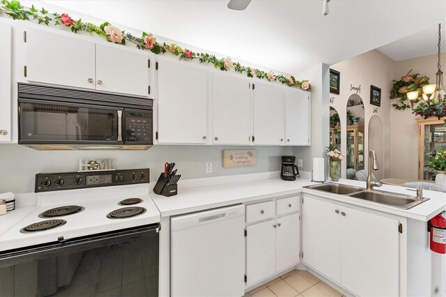 3300 Loveland Blvd Unit 1201, Punta Gorda, FL 33980 - kitchen with light countertops, electric range oven, white dishwasher, a sink, and black microwave