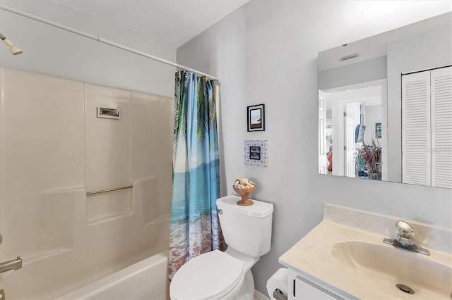 3300 Loveland Blvd Unit 1201, Punta Gorda, FL 33980 - bathroom featuring a closet, visible vents, toilet, shower / bath combo with shower curtain, and vanity