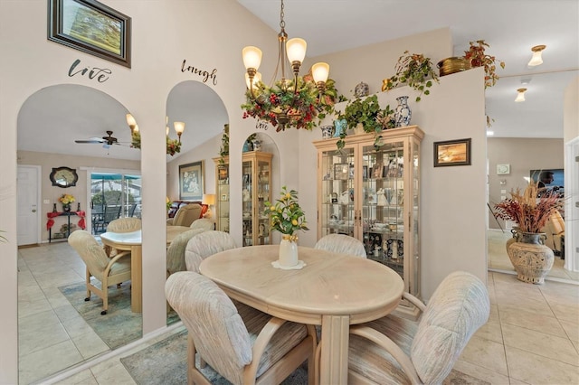 3300 Loveland Blvd Unit 1201, Punta Gorda, FL 33980 - dining area with high vaulted ceiling, arched walkways, light tile patterned flooring, and ceiling fan with notable chandelier