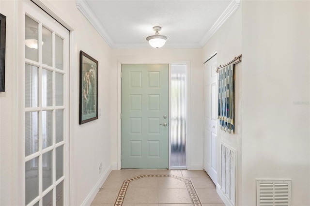 doorway with crown molding and light tile patterned flooring