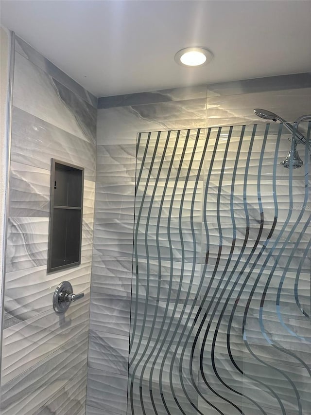 bathroom with a tile shower