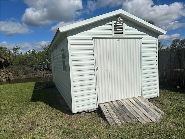 view of shed with fence