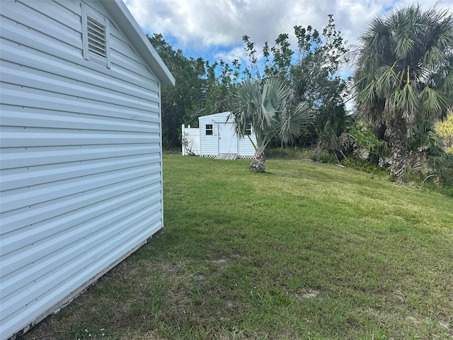 view of yard with a storage unit and an outdoor structure