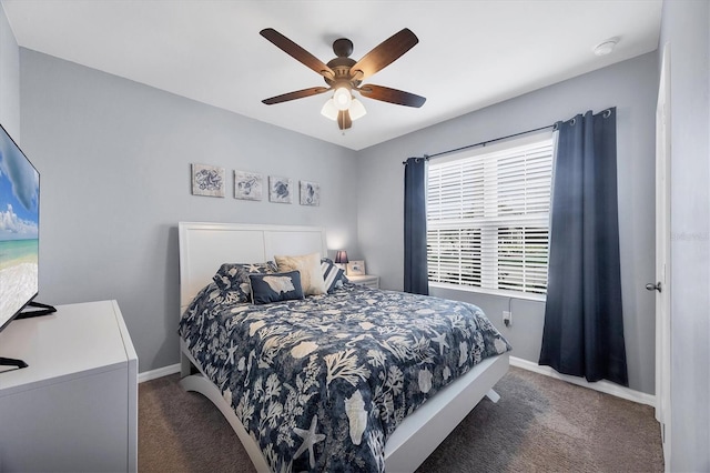 bedroom featuring ceiling fan and dark carpet