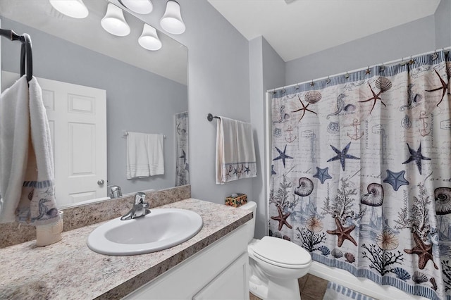 bathroom featuring vanity, a shower with curtain, tile patterned floors, and toilet