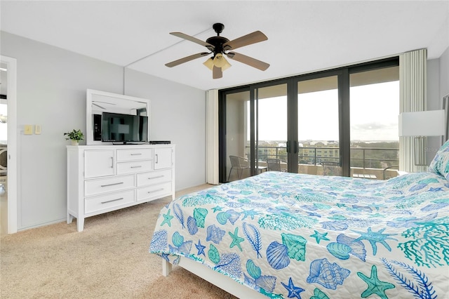 carpeted bedroom with access to exterior and ceiling fan