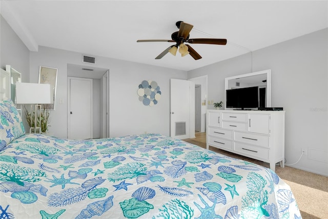 bedroom with light carpet and ceiling fan