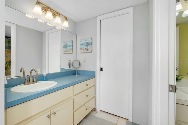 bathroom with vanity and tile patterned flooring