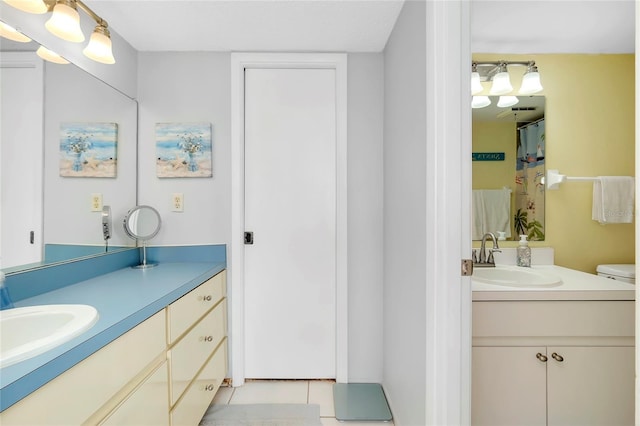 bathroom with vanity and tile patterned flooring