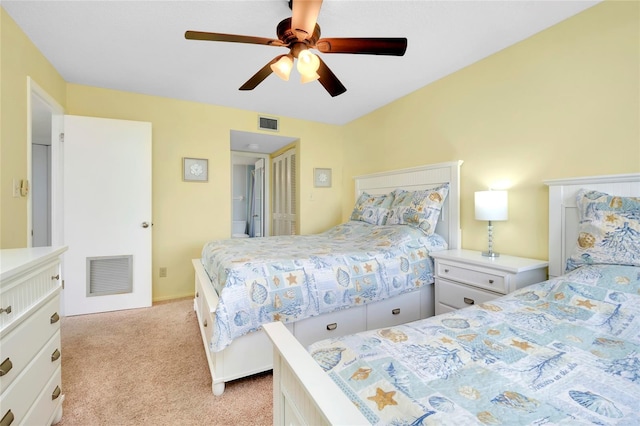 bedroom featuring ceiling fan, a closet, and light carpet