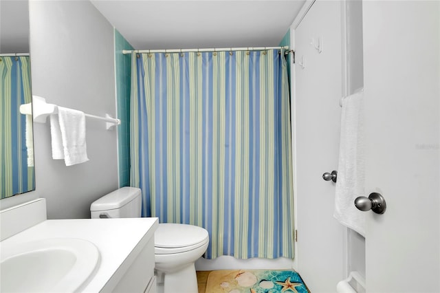 bathroom with tile patterned floors, vanity, toilet, and a shower with shower curtain