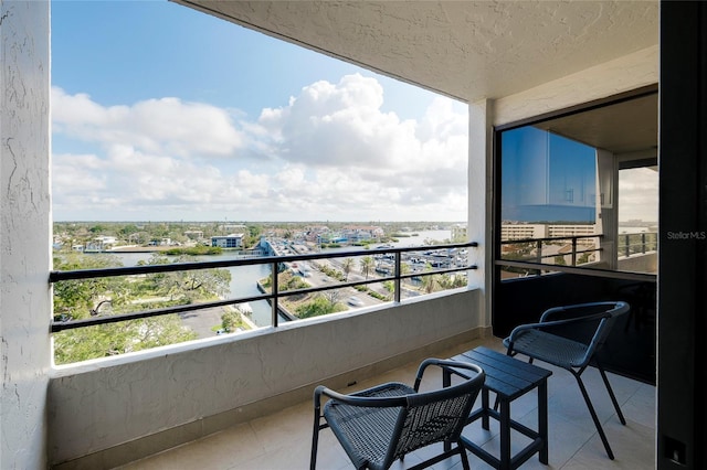 balcony featuring a water view