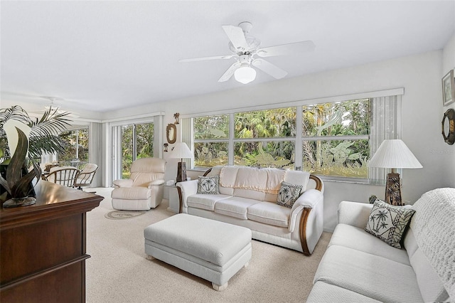 living room with light colored carpet and ceiling fan