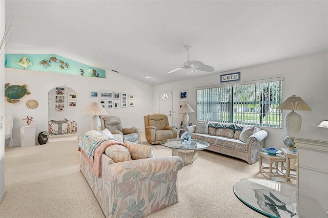 living room with vaulted ceiling, light colored carpet, and ceiling fan