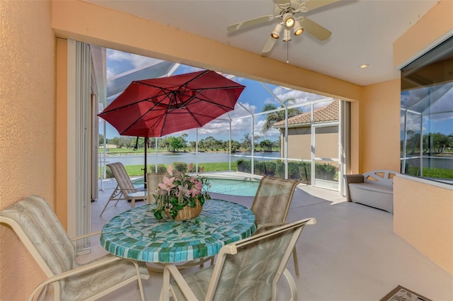 view of patio / terrace featuring glass enclosure