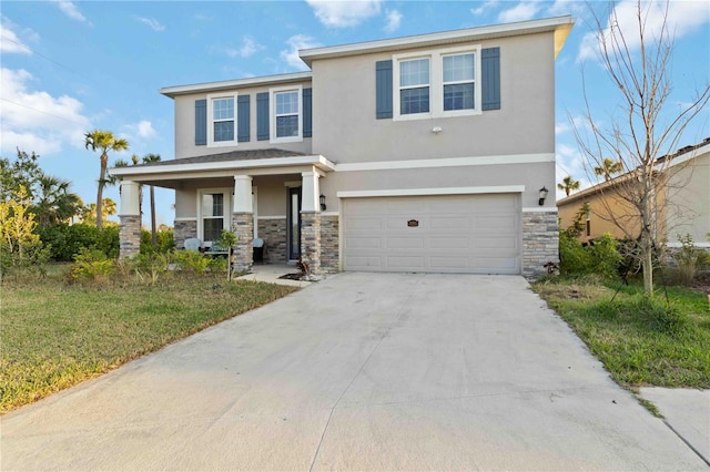 view of front of house featuring a garage, a porch, and a front lawn