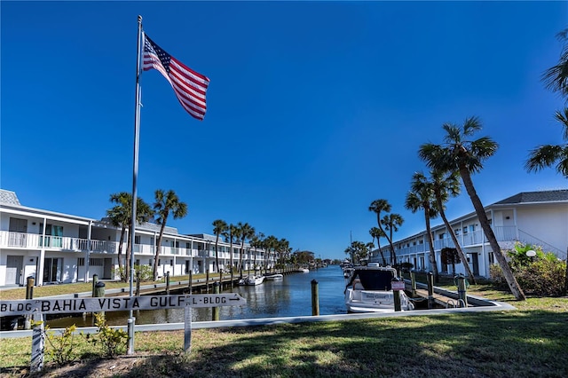 902 Gibbs Rd Unit 181, Venice, FL 34285 - dock featuring a lawn and a water view