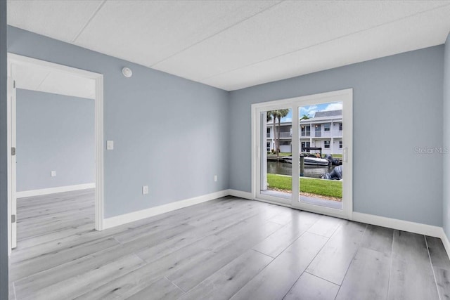 902 Gibbs Rd Unit 181, Venice, FL 34285 - spare room with wood finished floors