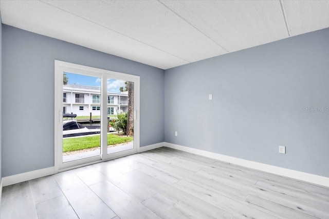 902 Gibbs Rd Unit 181, Venice, FL 34285 - empty room with wood finished floors