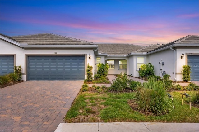 ranch-style house featuring a garage