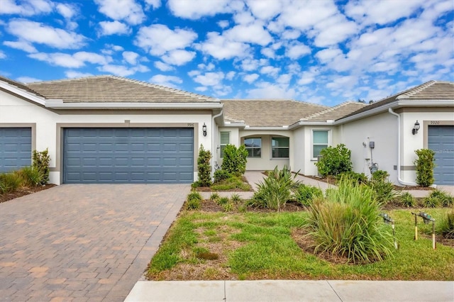 ranch-style house featuring a garage