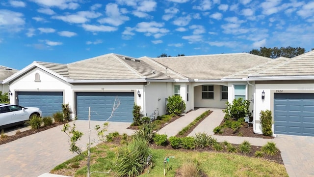 single story home featuring a garage