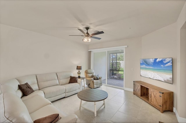 living room featuring ceiling fan and light tile patterned floors