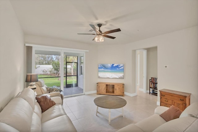 tiled living room with ceiling fan