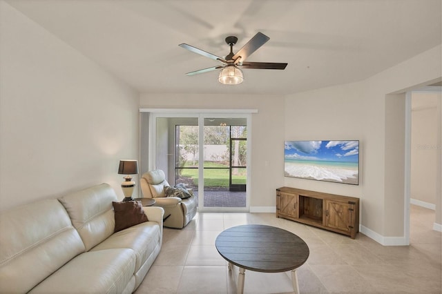 living room featuring light tile patterned floors and ceiling fan