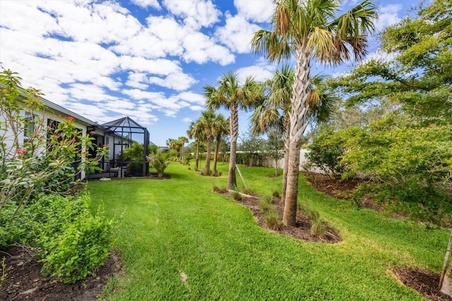 view of yard featuring a lanai