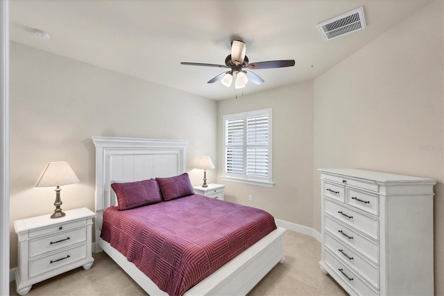 bedroom featuring ceiling fan and light carpet