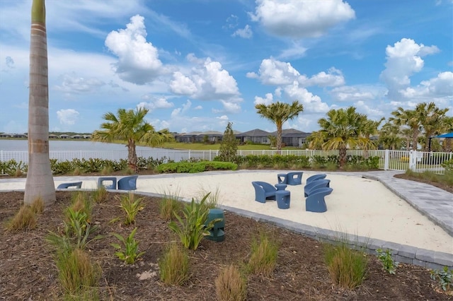 view of swimming pool with a water view