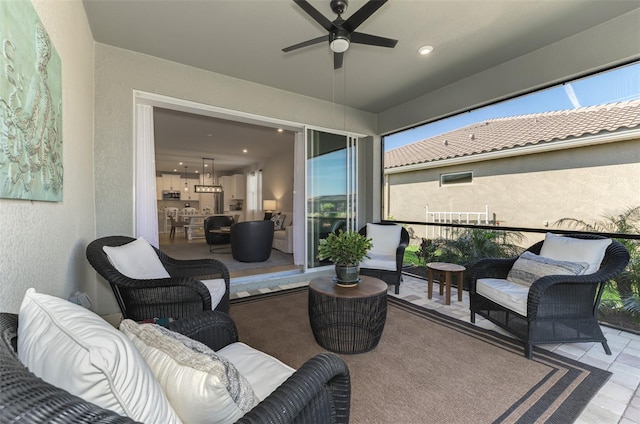 view of patio / terrace with ceiling fan and outdoor lounge area