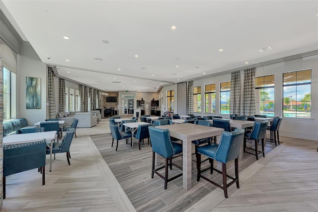 dining space with baseboards, visible vents, and recessed lighting