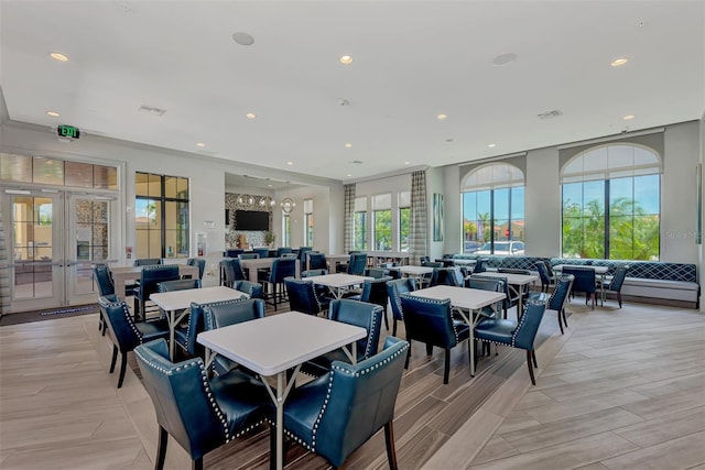 dining space featuring recessed lighting, french doors, and visible vents