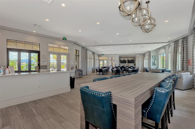 dining room with plenty of natural light, light wood-style flooring, visible vents, and recessed lighting