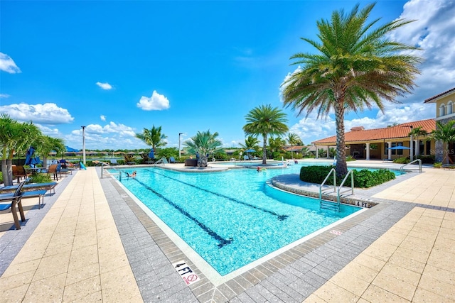 pool featuring a patio area and a jacuzzi