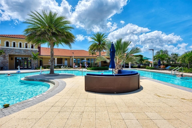 community pool with a patio