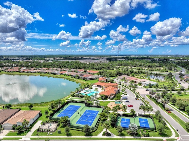 drone / aerial view featuring a water view and a residential view