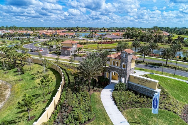 drone / aerial view with a residential view and a water view