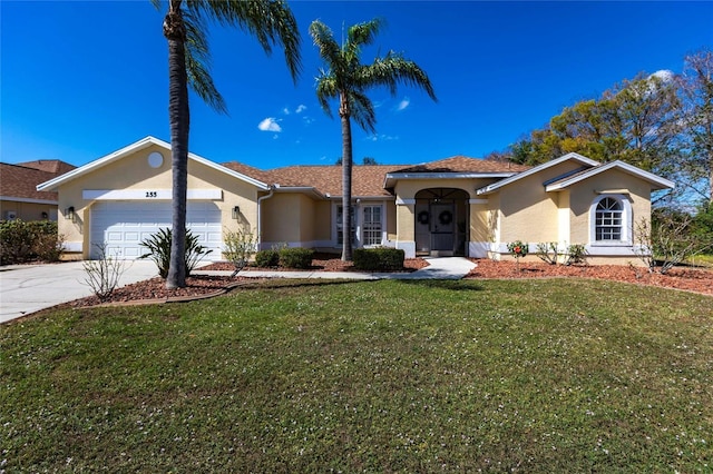 view of front of home featuring a front yard and a garage