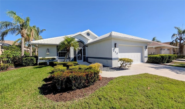 ranch-style home with driveway, a tile roof, an attached garage, a front yard, and stucco siding