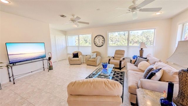 living area with recessed lighting, visible vents, plenty of natural light, and ceiling fan